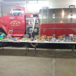 Snacks on table in front of fire truck